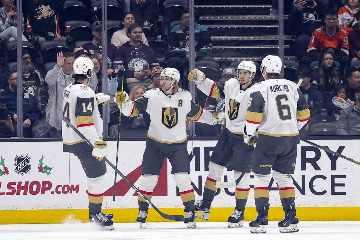 Vegas Golden Knights center William Karlsson, second from left, celebrates scoring against the ...