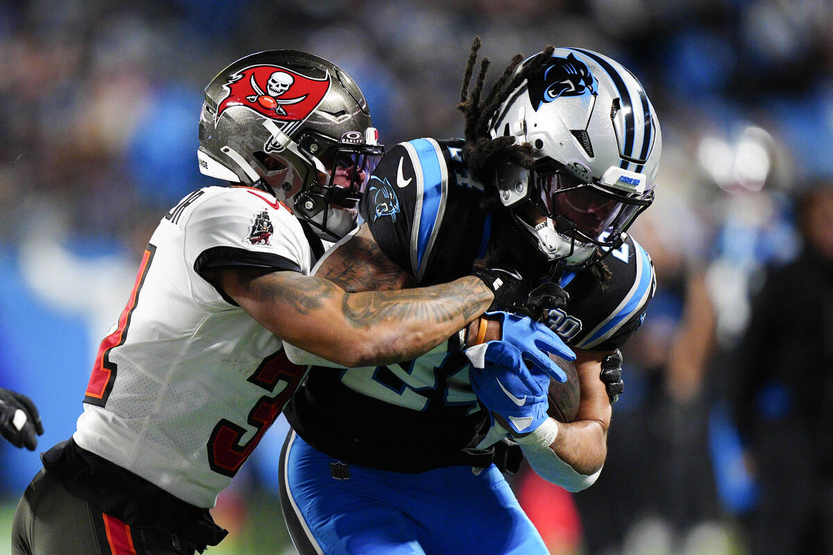 Carolina Panthers running back Jonathon Brooks is tackled by Tampa Bay Buccaneers safety Antoin ...