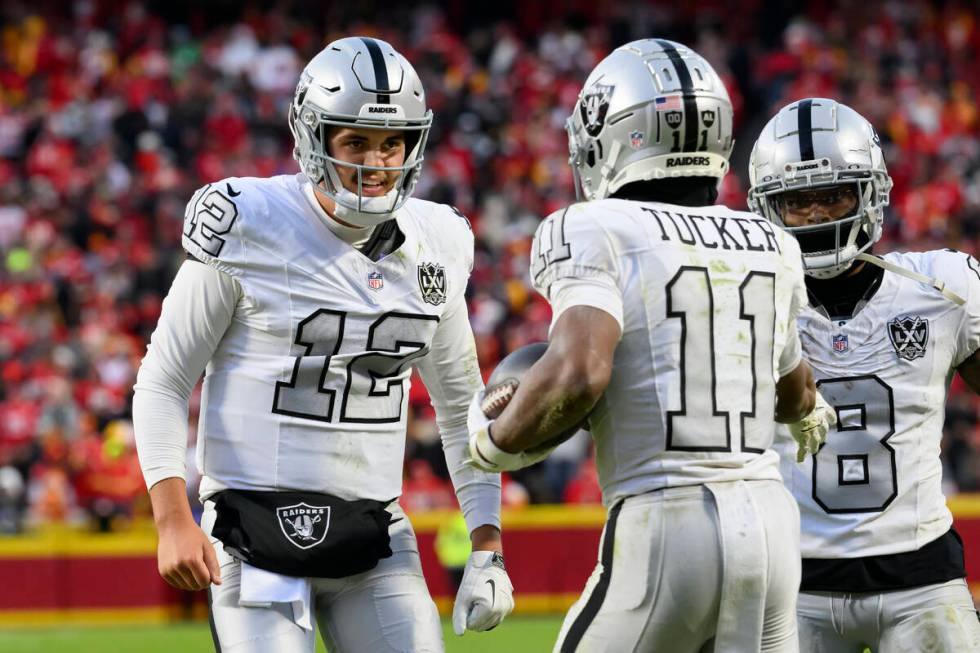 Las Vegas Raiders quarterback Aidan O'Connell (12) congratulates Raiders wide receiver Tre Tuck ...