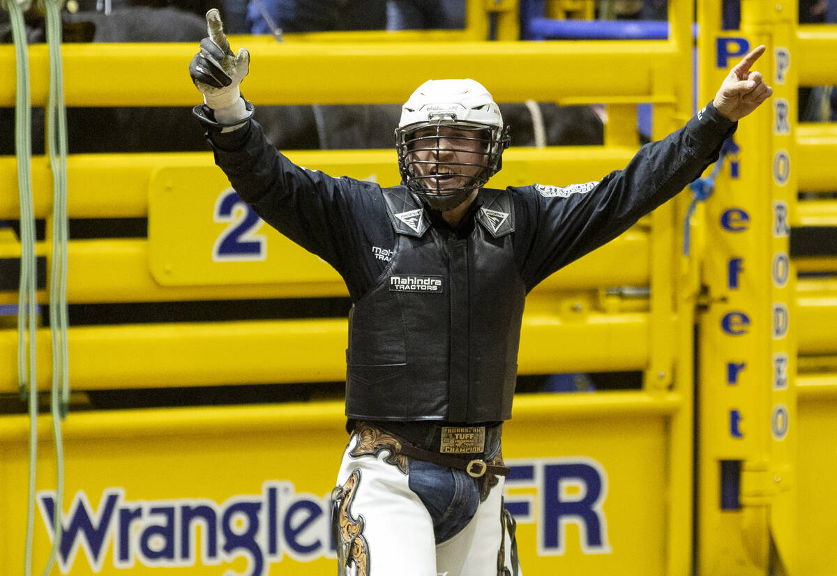 Trey Kimzey celebrates after competing in the bull riding event during opening night of the Nat ...