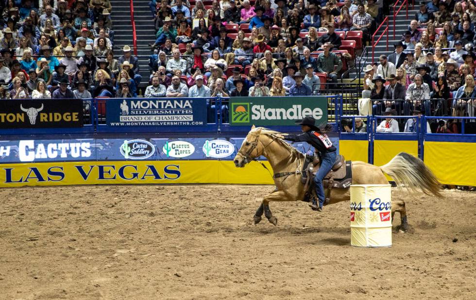 Hailey Kinsel competes in the barrel racing event during opening night of the National Finals R ...