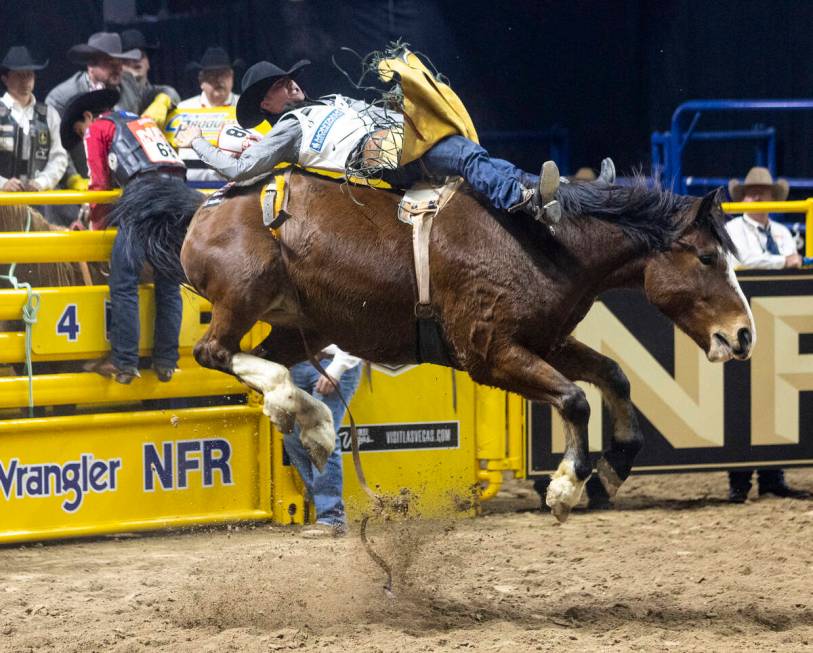 Weston Timberman competes in the bareback riding event during opening night of the National Fin ...