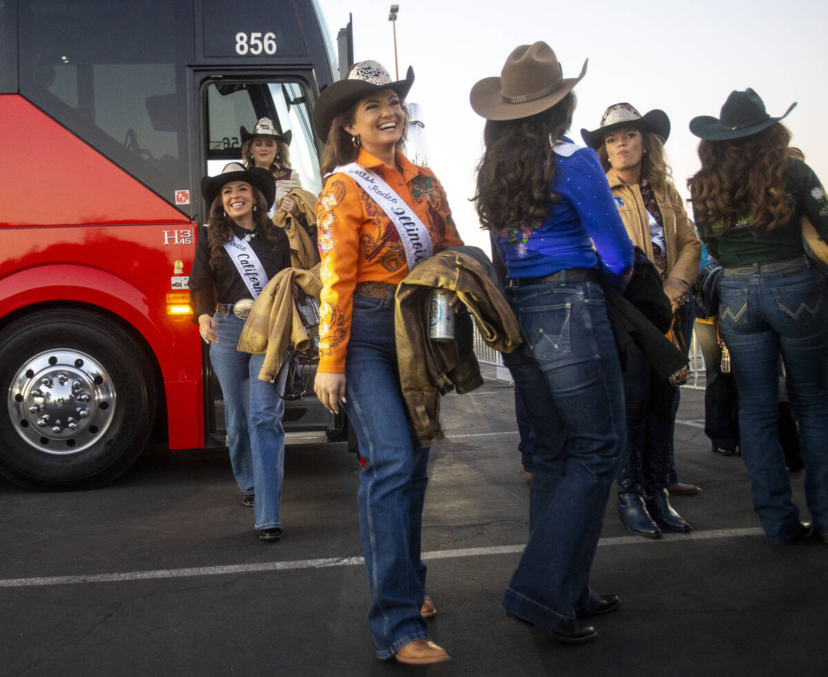 A group of state Miss Rodeo queens exit a charter bus before opening night of the National Fina ...