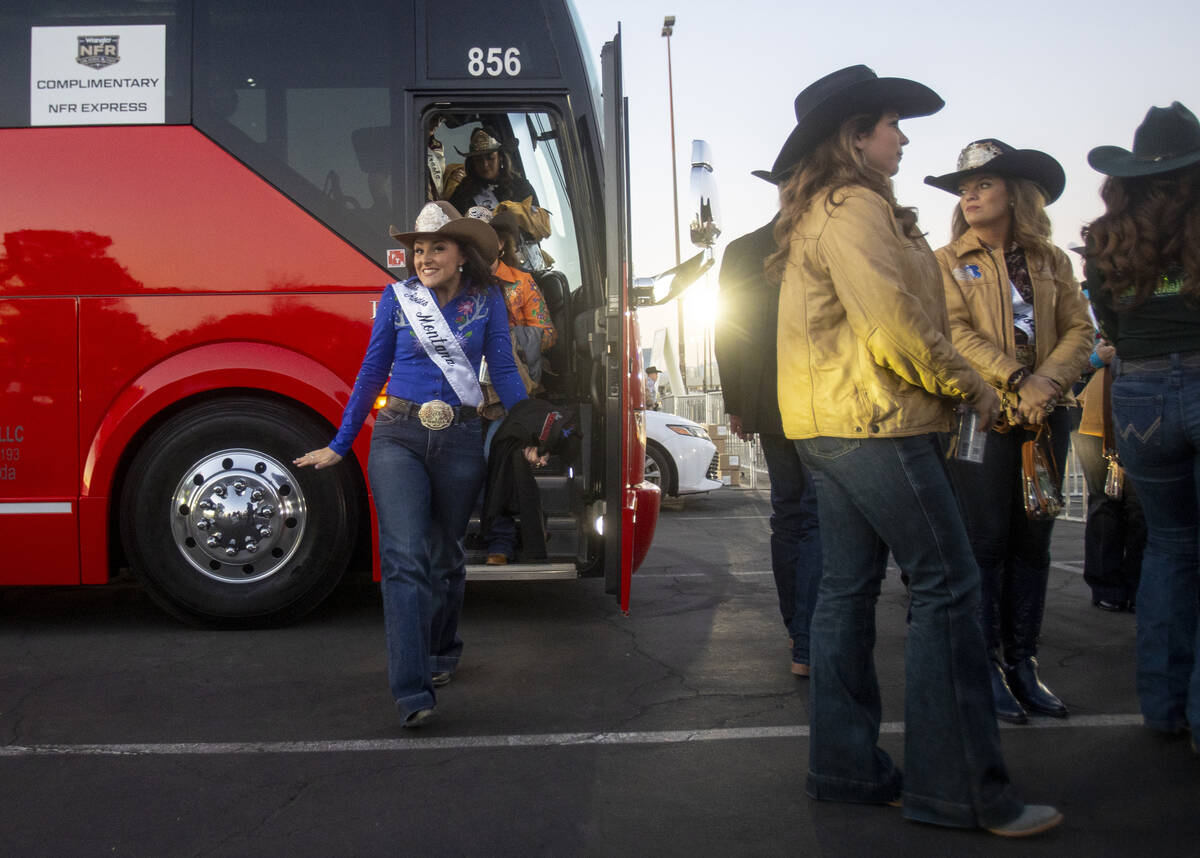 A group of state Miss Rodeo queens exit a charter bus before opening night of the National Fina ...