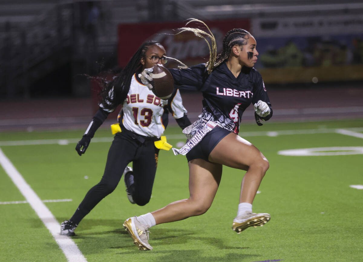 Liberty's Kilolo Westerlund (4) runs the ball against Del Sol during a flag football game at Li ...