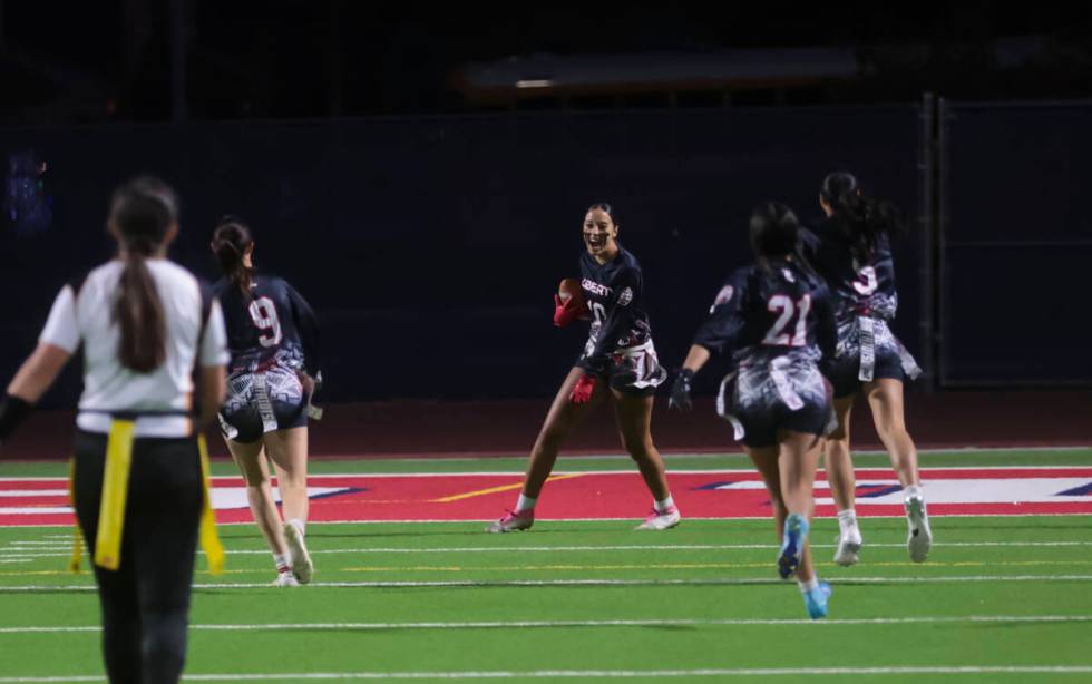 Liberty's safety Nai’a Pomaikai (10) scores touchdown on an interception against Del Sol ...