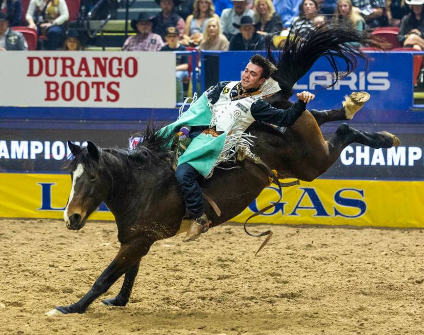 Bareback rider Bradlee Miller rides True Grit to a winning time during National Finals Rodeo Da ...