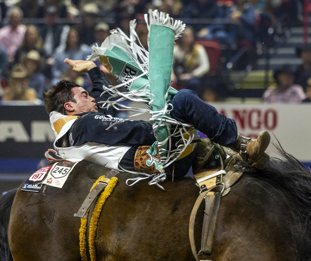 Bareback rider Bradlee Miller rides True Grit to a winning time during National Finals Rodeo Da ...