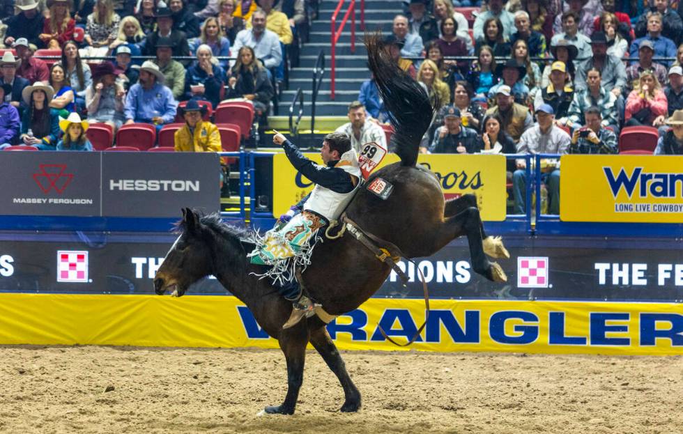 Bareback rider Bradlee Miller rides True Grit to a winning time during National Finals Rodeo Da ...