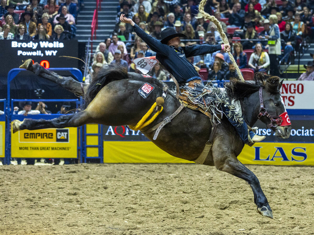 Saddle Bronc Riding competitor Brody Wells lays back on Resistol's Pretty Woman for a winning r ...