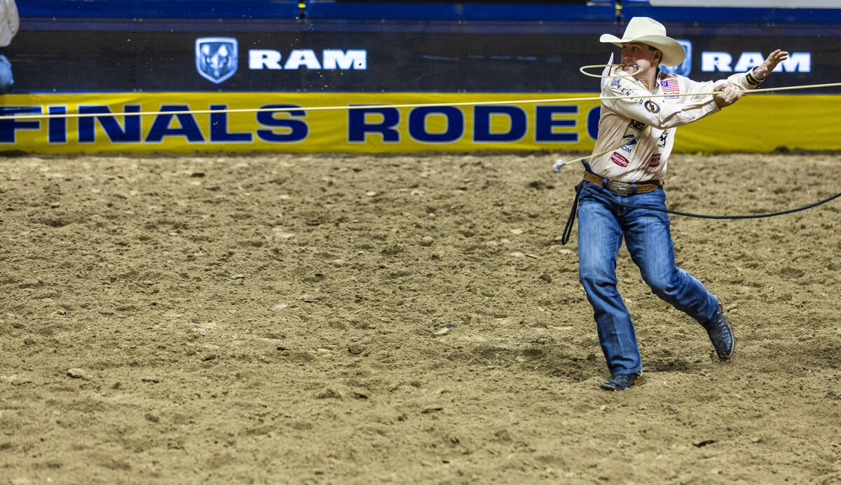 Tie-Down Roping competitor Riley Webb follows a rope to his calf on the way to a winning time d ...