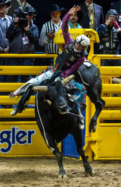 Bull Riding competitor Jeter Lawrence stays atop of Buck Nasty for a winning ride during Nation ...