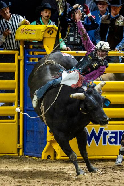 Bull Riding competitor Jeter Lawrence stays atop of Buck Nasty for a winning ride during Nation ...