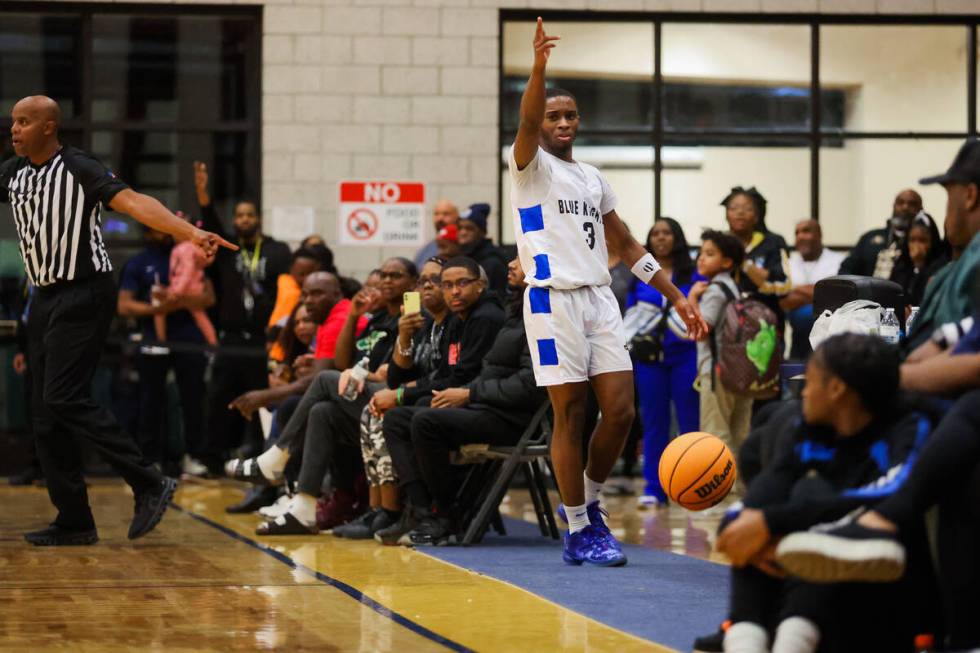 Democracy Prep guard DaShaun Harris points to the other side of the court to signal that it is ...