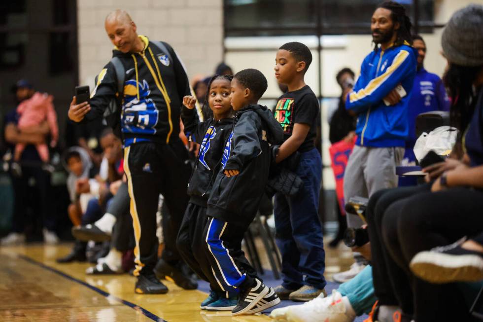 Young Democracy Prep fans dance during a time out at a boys basketball game between Mater East ...