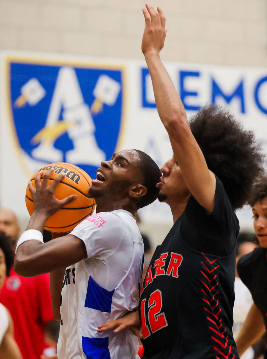 Democracy Prep guard DaShaun Harris (3) fights to keep possession of the ball as Mater shooting ...