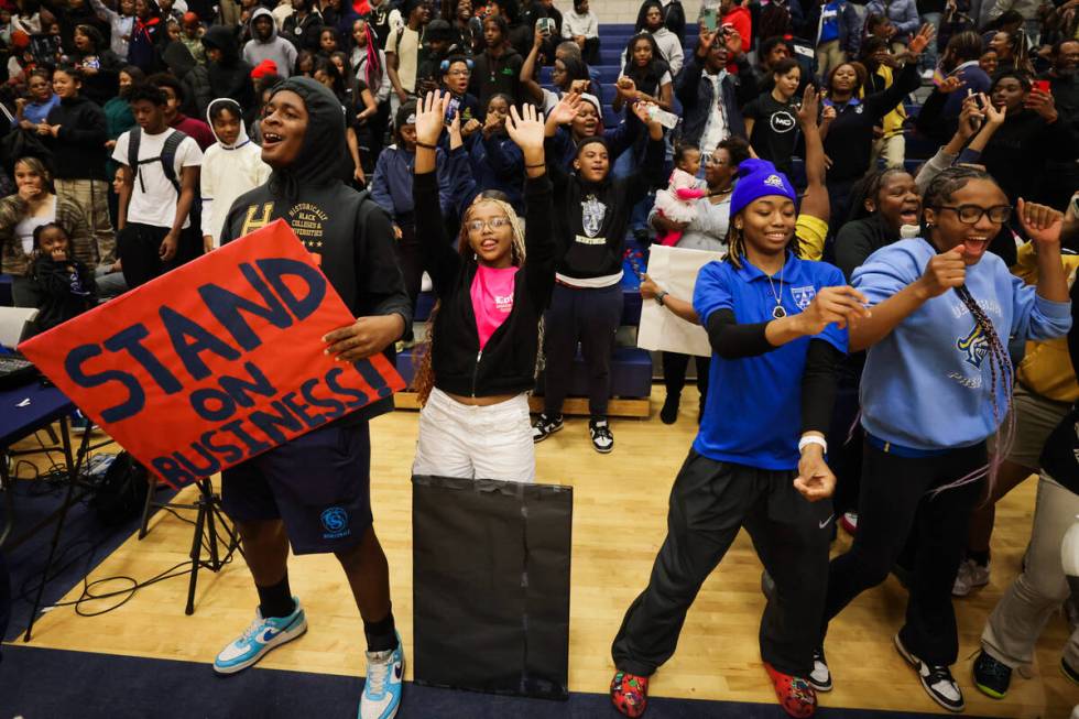 Democracy Prep fans cheer during a boys basketball game between Mater East and Democracy Prep a ...