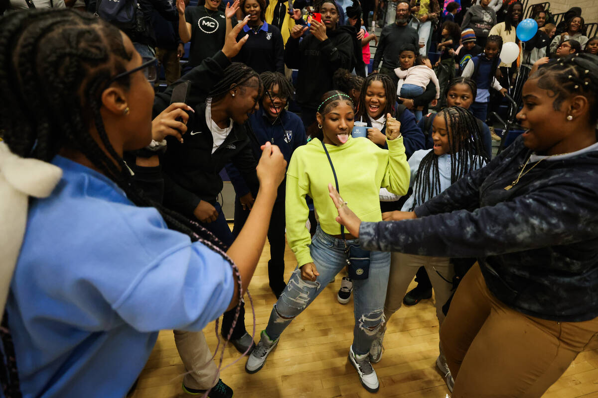 Democracy prep fans dance after their team won during a boys basketball game between Mater East ...