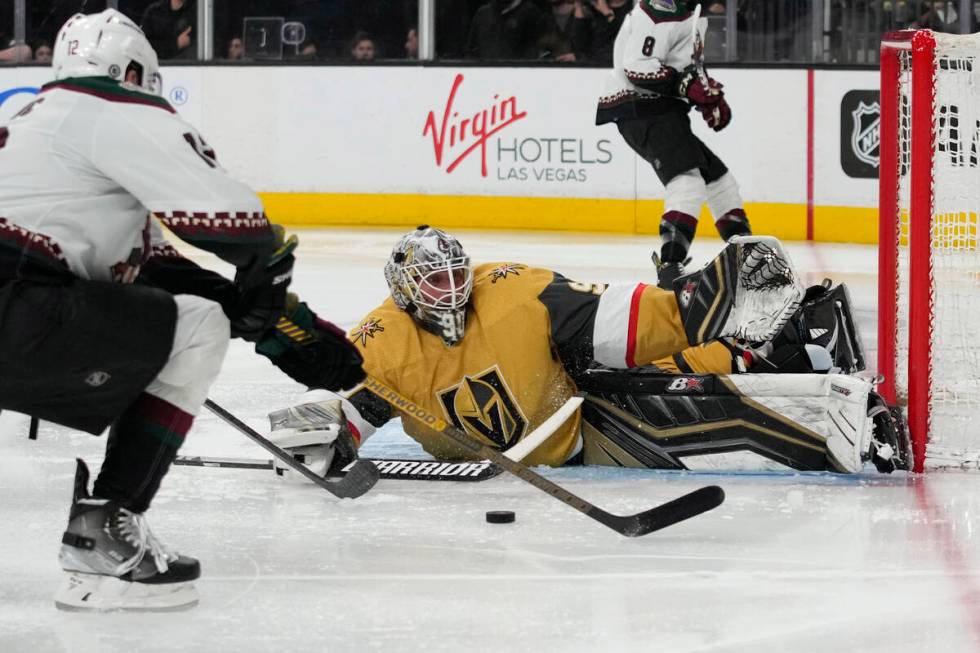 Vegas Golden Knights goaltender Robin Lehner (90) stops a shot by Arizona Coyotes left wing Nic ...