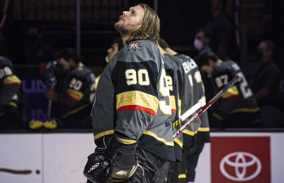 Golden Knights goaltender Robin Lehner (90) looks on while standing for the national anthem bef ...