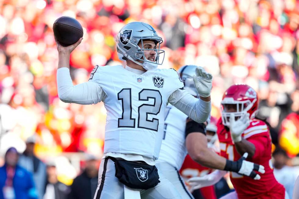 Las Vegas Raiders quarterback Aidan O'Connell (12) throws against the Kansas City Chiefs during ...