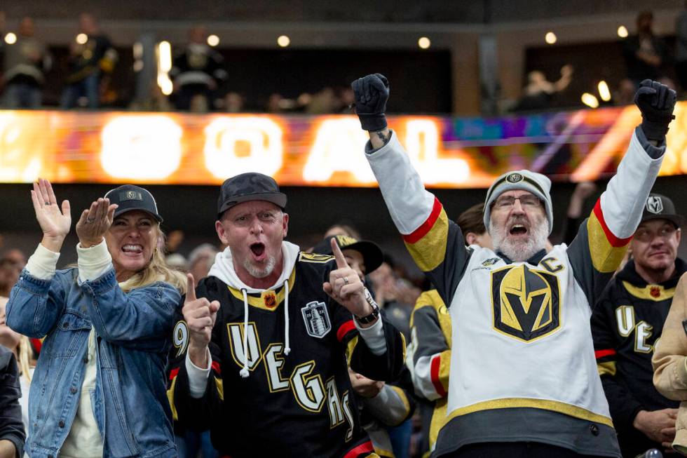 Golden Knights fans react after a goal is scored during the second period of the NHL hockey gam ...