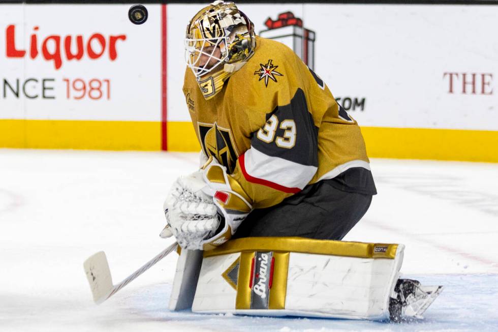 Golden Knights goaltender Adin Hill (33) blocks a shot during the second period of the NHL hock ...