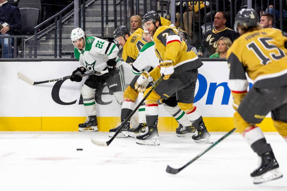 Golden Knights and Dallas Stars players compete for the puck during the second period of the NH ...