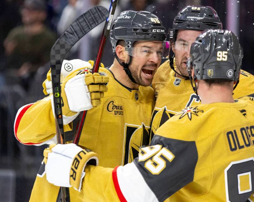 Golden Knights center Tomas Hertl (48) celebrates with teammates after scoring a power play goa ...