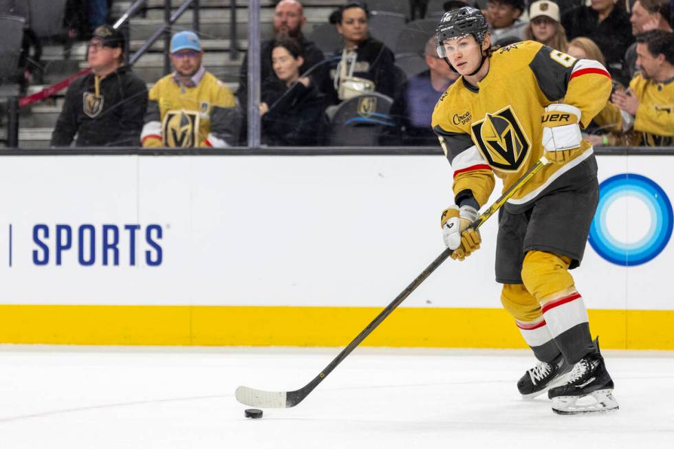 Golden Knights defenseman Kaedan Korczak (6) passes the puck during the NHL hockey game against ...