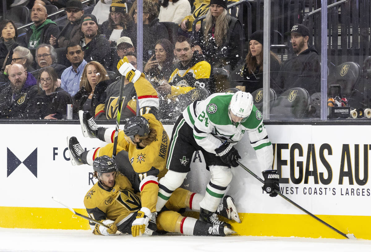 Dallas Stars center Roope Hintz (24) causes Golden Knights center William Karlsson (71) and Gol ...