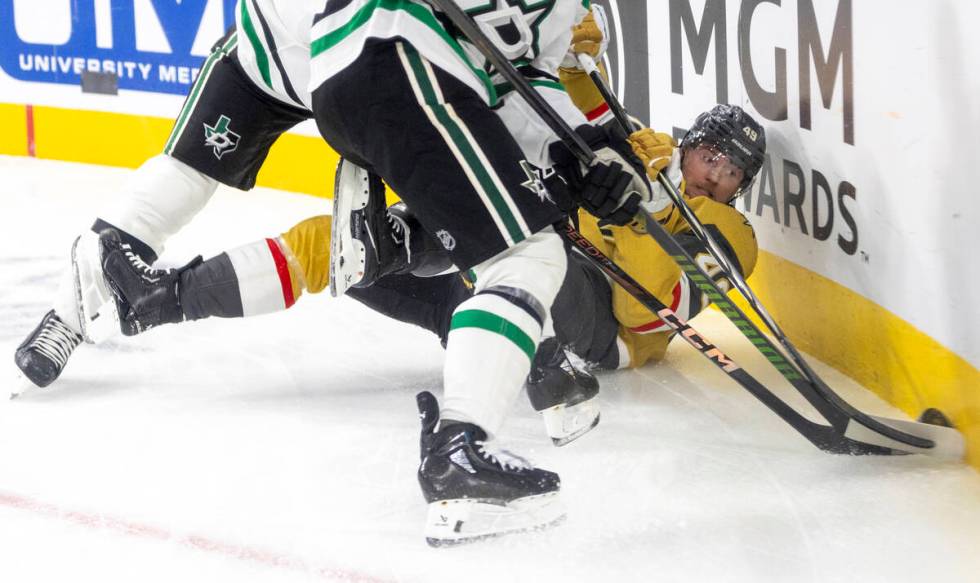 Golden Knights center Ivan Barbashev (49) fights for the puck during the first period of the NH ...