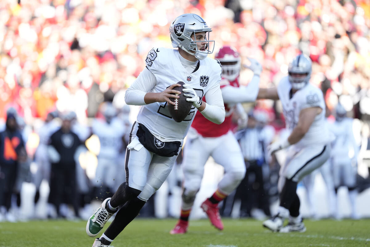 Las Vegas Raiders quarterback Aidan O'Connell drops back for a pass during an NFL football game ...