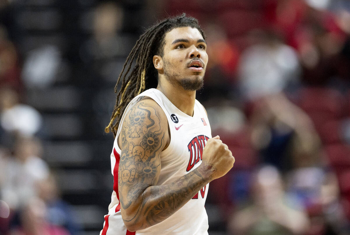 UNLV forward Jeremiah Cherry pumps his fist after a play during the college basketball game aga ...