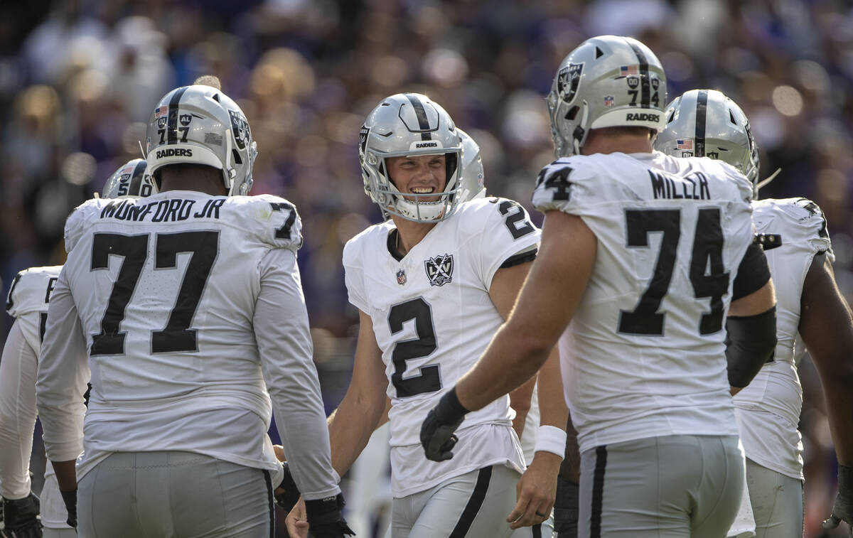 Raiders place kicker Daniel Carlson (2) celebrates his go-ahead field goal with Raiders offensi ...