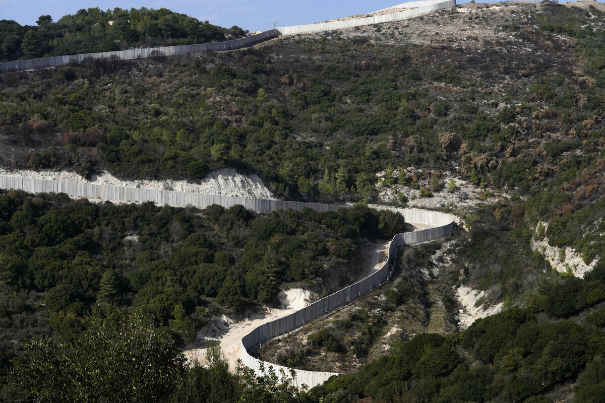 A general view the border wall between Israel and Lebanon as seen from northern Israel, Friday, ...