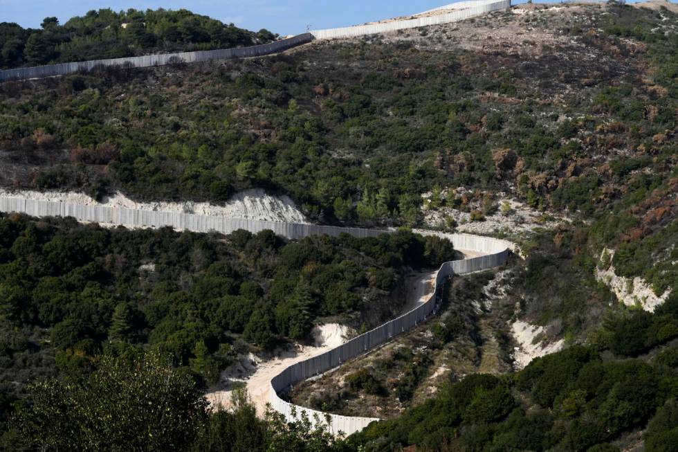 A general view the border wall between Israel and Lebanon as seen from northern Israel, Friday, ...