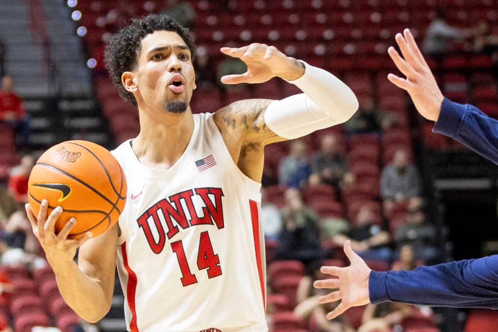 UNLV guard Jailen Bedford (14) directs his teammates during the college basketball game against ...