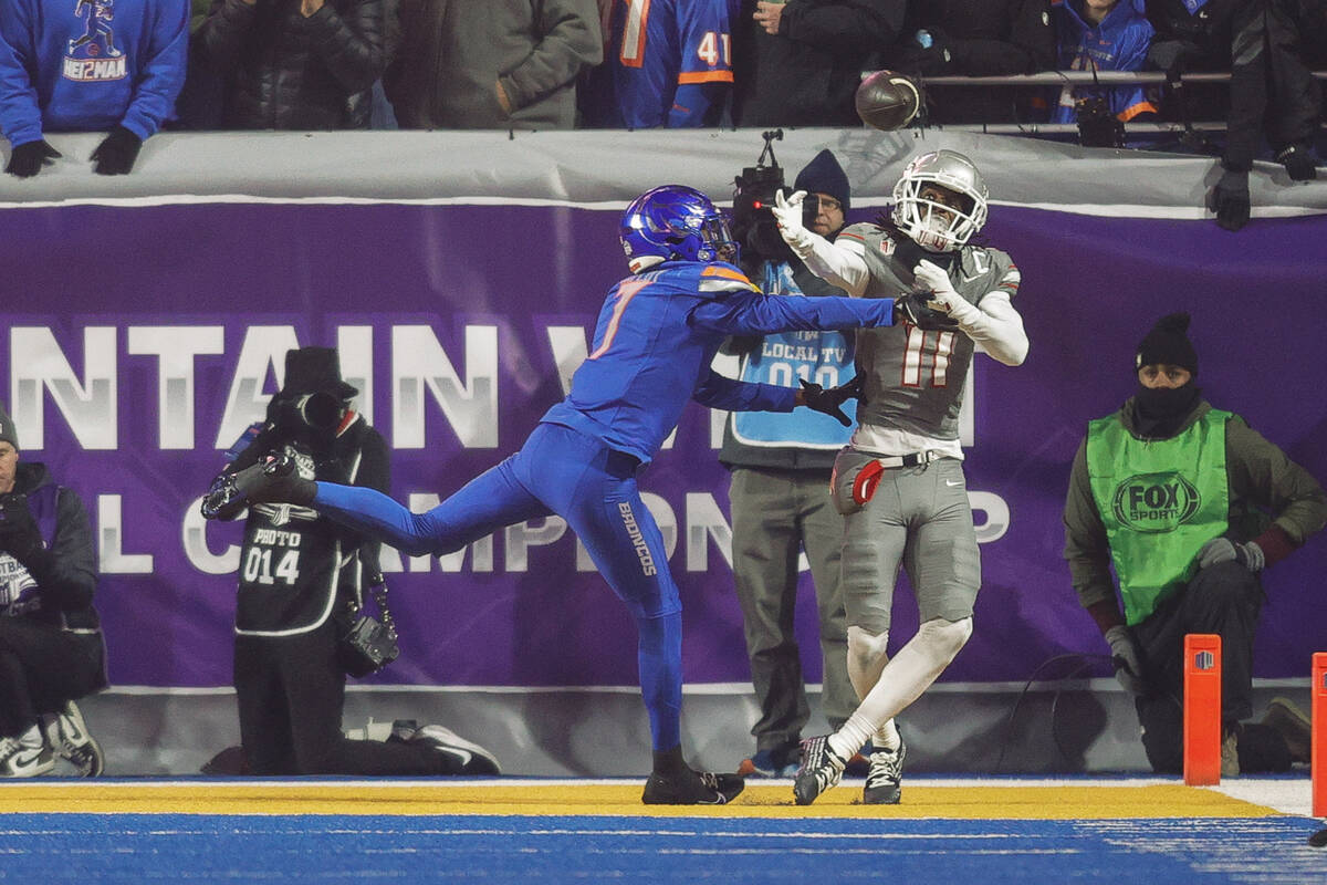 Boise State cornerback A'Marion McCoy (7) knocks the ball away from UNLV wide receiver Ricky Wh ...