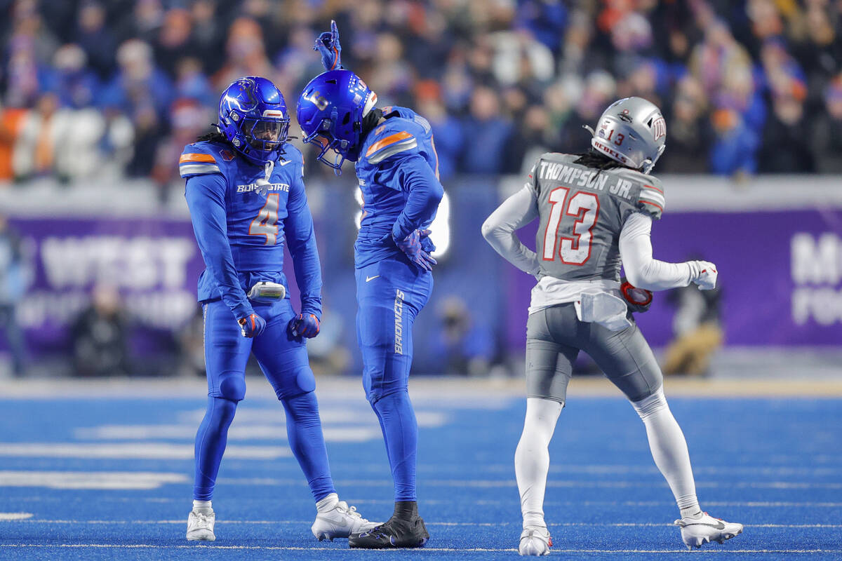 Boise State cornerback Jeremiah Earby, center celebrates with safety Rodney Robinson (4) after ...