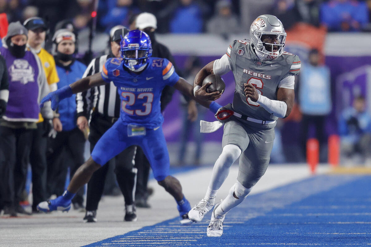 UNLV quarterback Hajj-Malik Williams (6) runs with the ball down the Boise State sideline in th ...