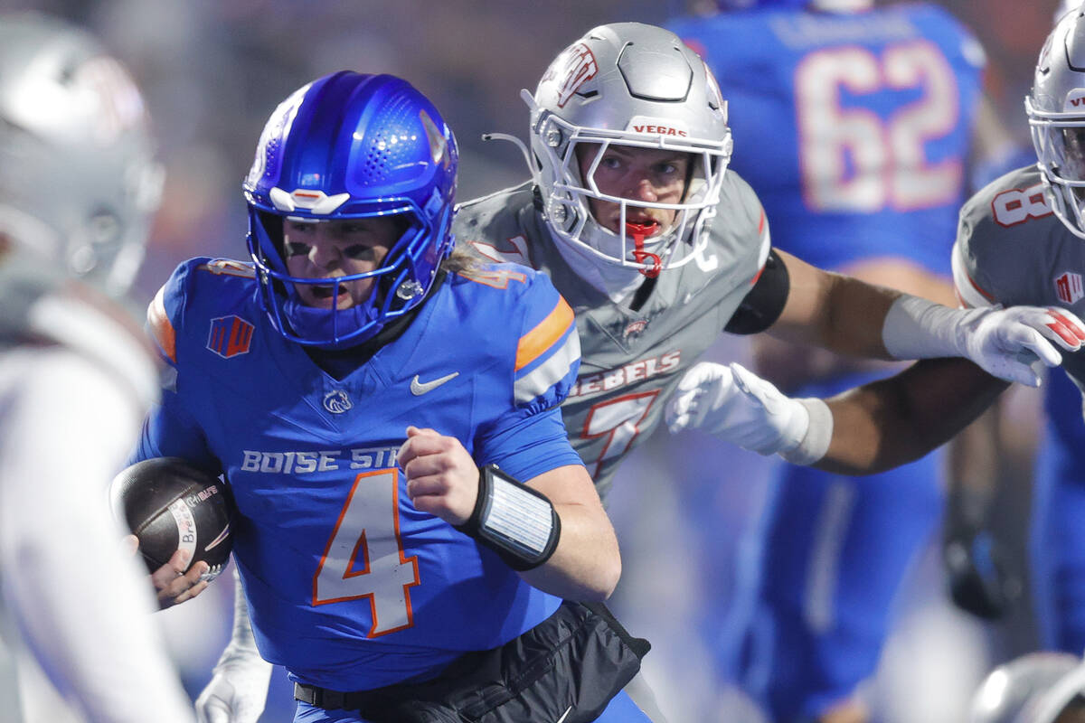 Boise State quarterback Maddux Madsen (4) runs through the UNLV defense on a touchdown run in t ...