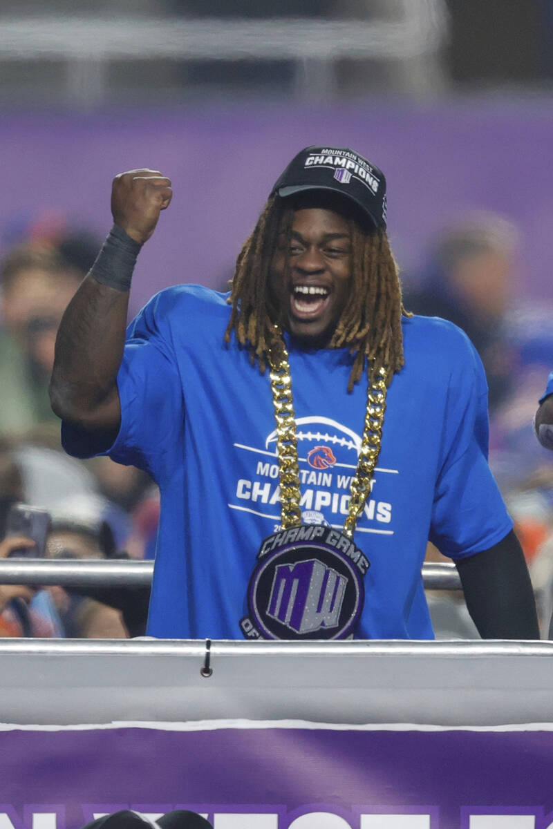 Boise State running back Ashton Jeanty celebrates after winning the offensive player of the gam ...