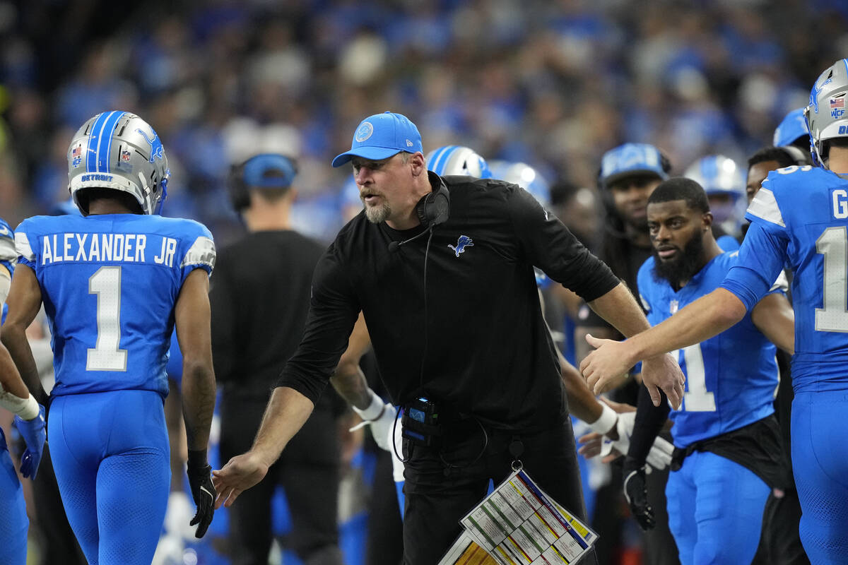 Detroit Lions head coach Dan Campbell greets wide receiver Maurice Alexander (1) during an NFL ...