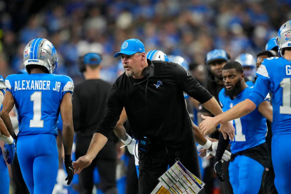 Detroit Lions head coach Dan Campbell greets wide receiver Maurice Alexander (1) during an NFL ...