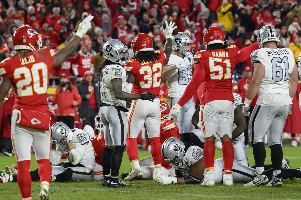 The Kansas City Chiefs celebrate Chiefs linebacker Nick Bolton's fumble recovery (center) from ...