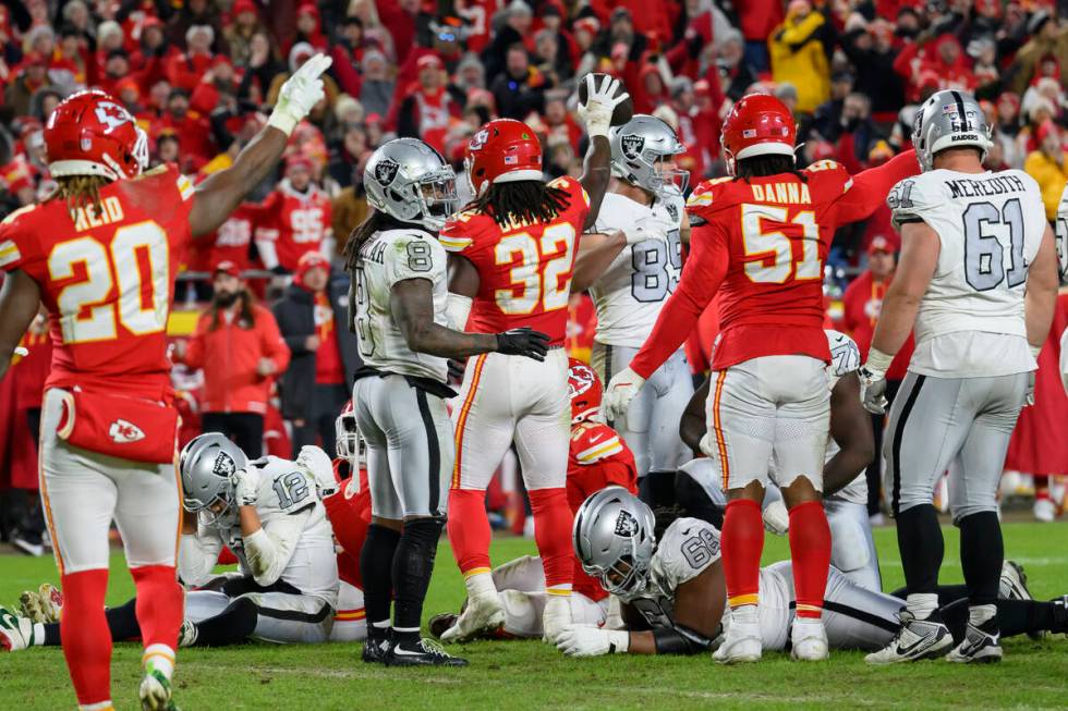 The Kansas City Chiefs celebrate Chiefs linebacker Nick Bolton's fumble recovery (center) from ...