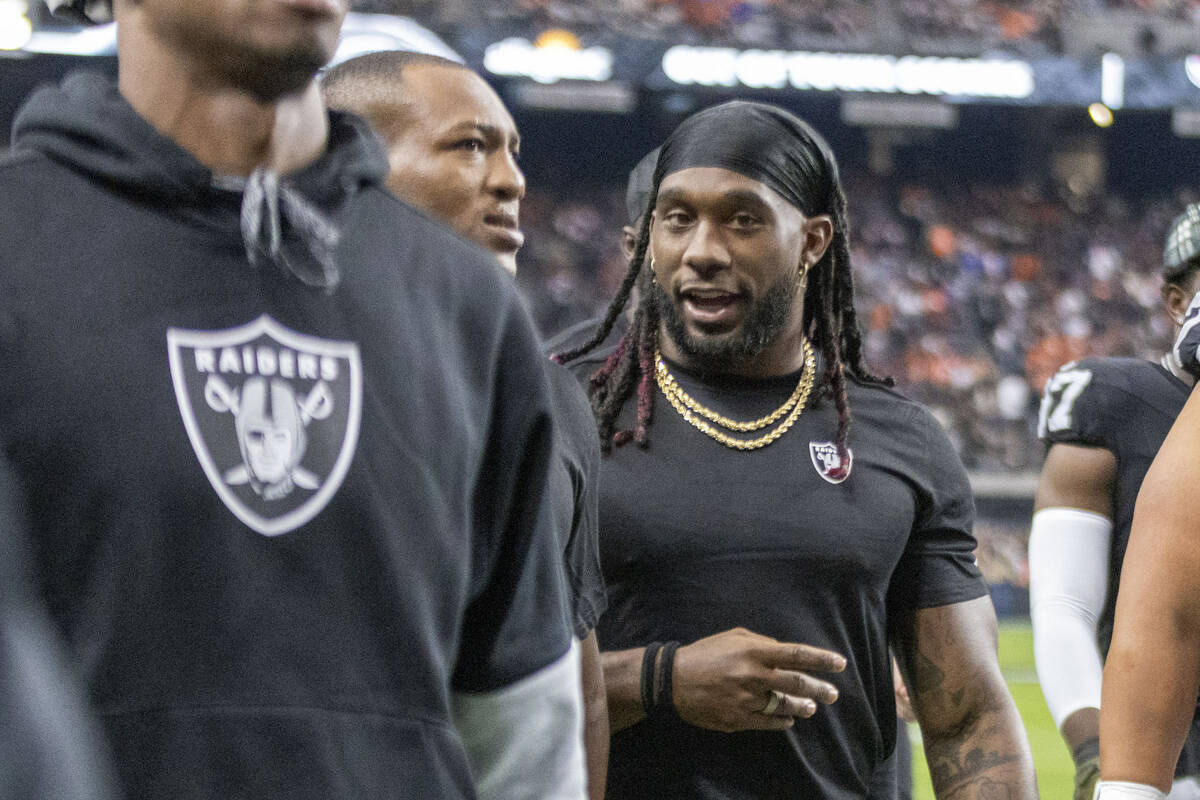 Raiders running back Alexander Mattison walks off the field for halftime of an NFL game against ...