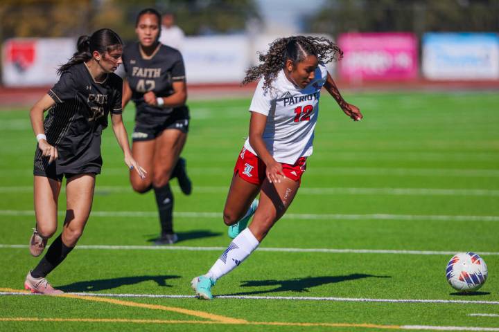 Liberty midfielder Ayva Jordan (12) controls the ball during a 5A girls soccer state championsh ...