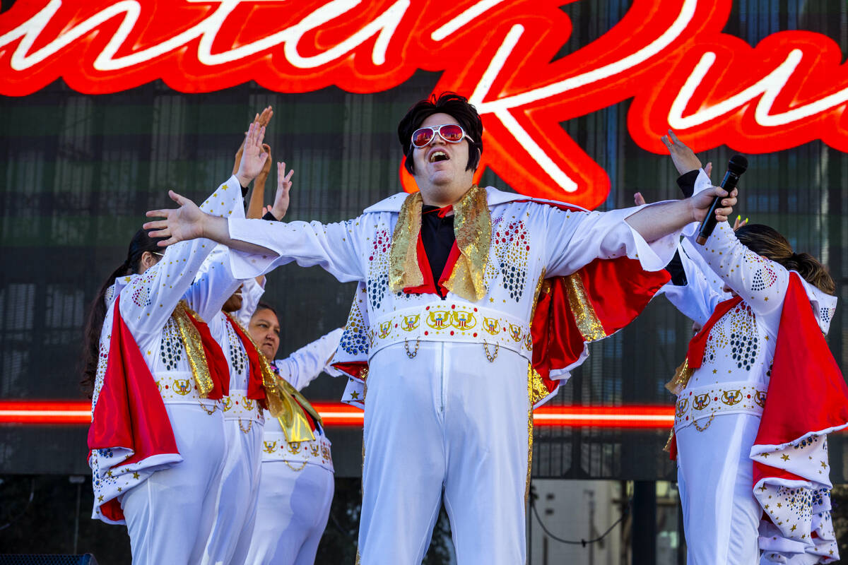 The OV Elvi perform on stage at the Downtown Las Vegas Events Center before thousands of Santas ...